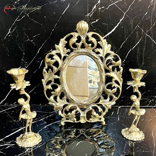 آینه و شمعدان برنزی بیضی شکل طرح برگ درخت و طلایی رنگ
